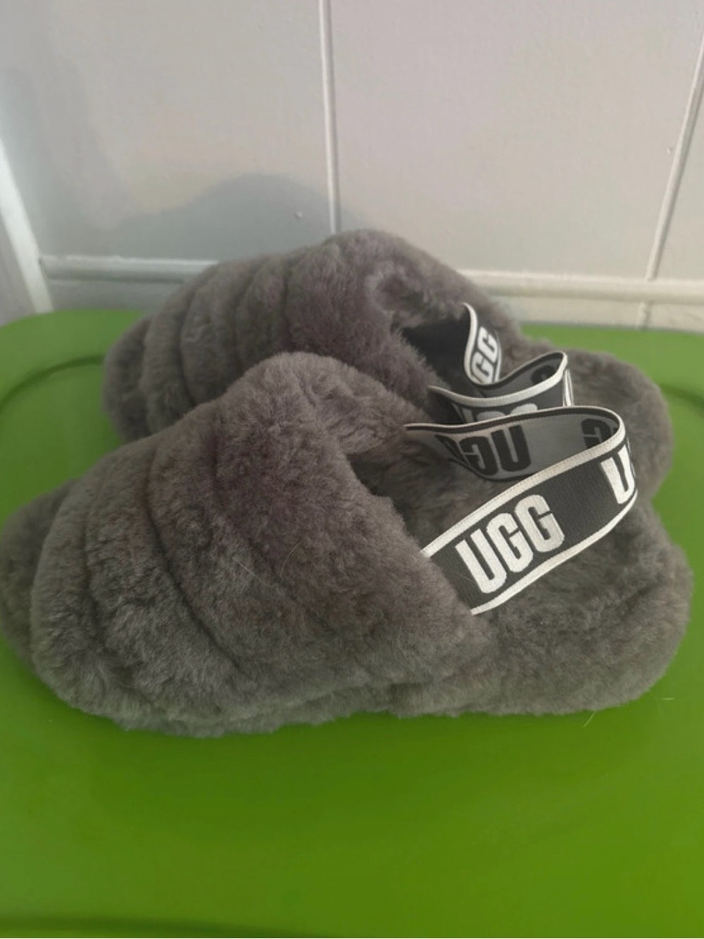 UGG women’s Grey Fluff Slide with Logo Strap